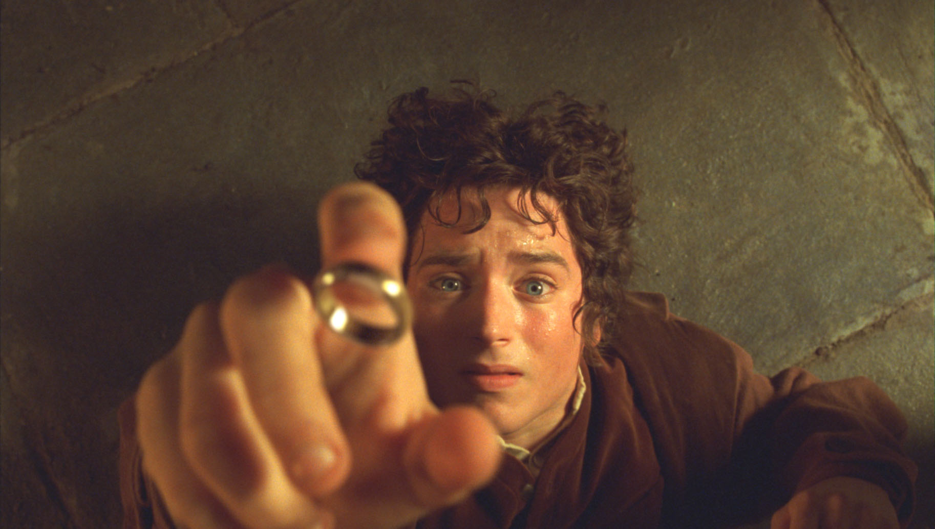 Frodo Baggins first time using the ring in the Prancing Pony. 
